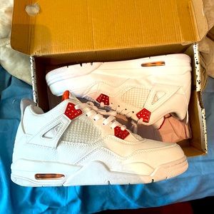 ORANGE METALLIC JORDAN 4s